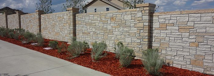 Don't go with wood, a concrete block fence is maintenance free! 