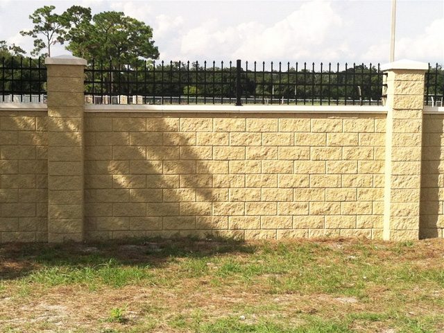 Split Block Wall with extended columns and ornamental iron accents